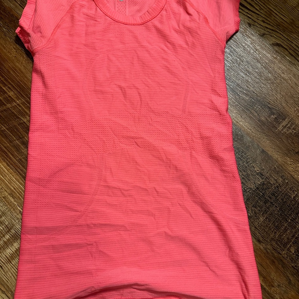 3 shades of pink lululemon tops size 6. Never worn but no tags.